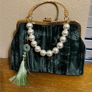 Elegant Green Velvet Handbag with Gold Accents